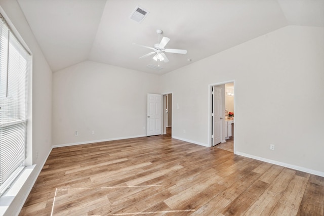 interior space with light wood-type flooring, vaulted ceiling, and ceiling fan