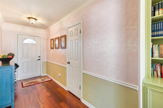 entrance foyer featuring dark hardwood / wood-style flooring and crown molding