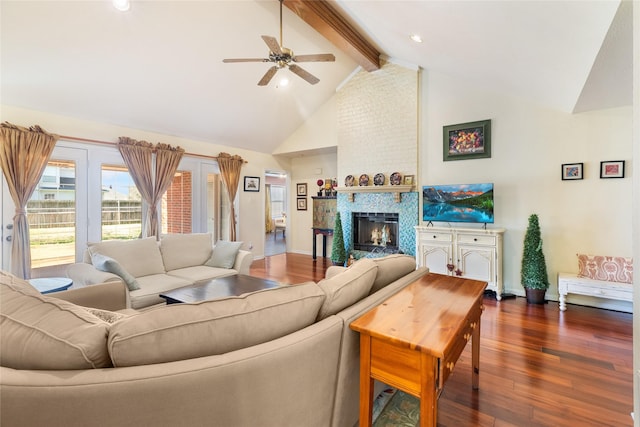 living room with dark hardwood / wood-style floors, ceiling fan, a fireplace, high vaulted ceiling, and beam ceiling