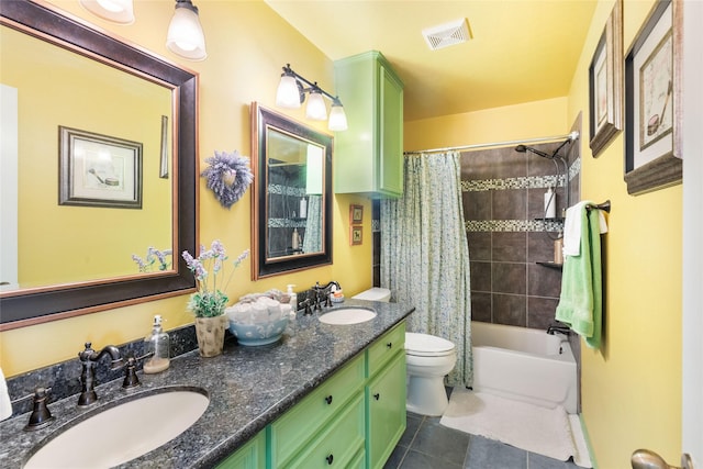 full bathroom with tile patterned floors, shower / tub combo, vanity, and toilet