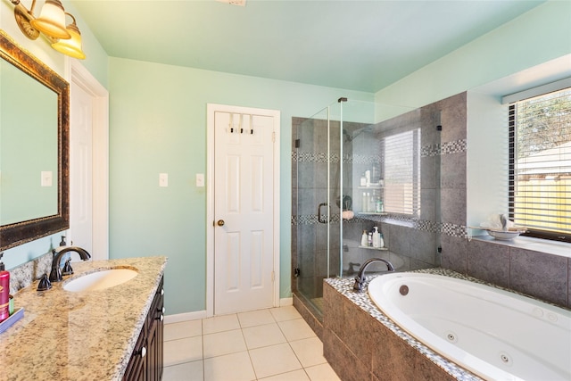 bathroom featuring vanity, independent shower and bath, and tile patterned flooring