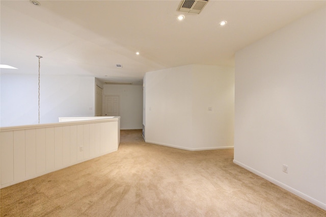 empty room featuring light colored carpet