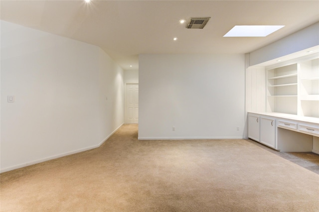 unfurnished room with light carpet