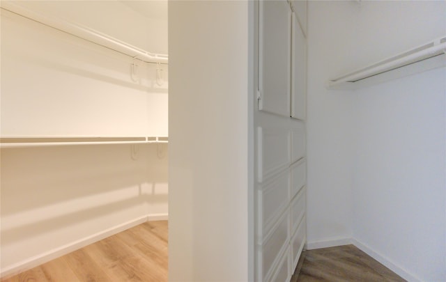 walk in closet featuring hardwood / wood-style floors