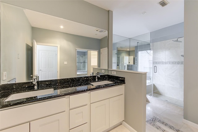 bathroom with vanity and walk in shower