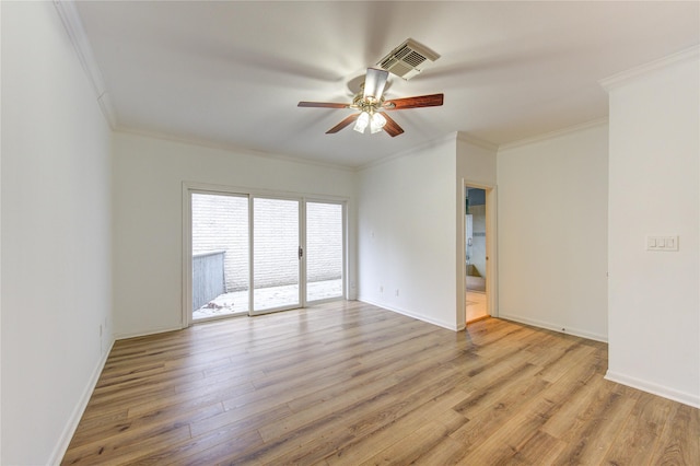 spare room with ceiling fan, light wood-type flooring, and crown molding