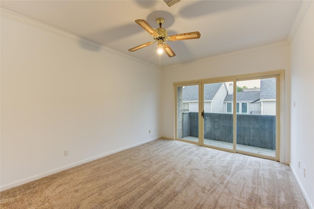 empty room featuring ceiling fan, light colored carpet, and ornamental molding