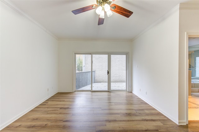 spare room featuring ceiling fan, ornamental molding, and light hardwood / wood-style floors