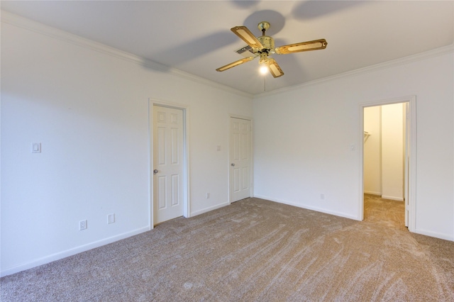 unfurnished bedroom with ceiling fan, ornamental molding, and light colored carpet