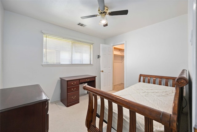 bedroom with light carpet and ceiling fan