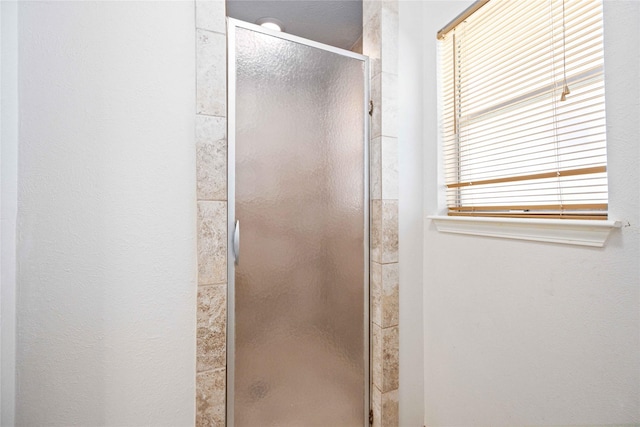 bathroom with an enclosed shower