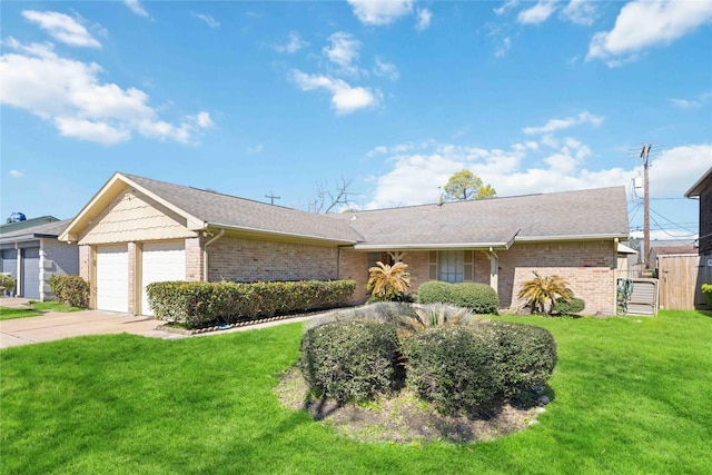 ranch-style house featuring a garage and a front lawn