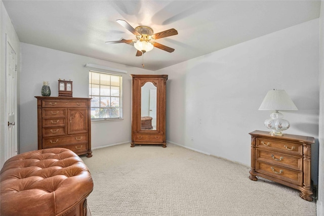 sitting room featuring ceiling fan and light colored carpet