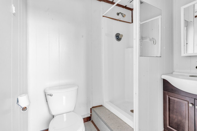 bathroom with a shower, toilet, and vanity