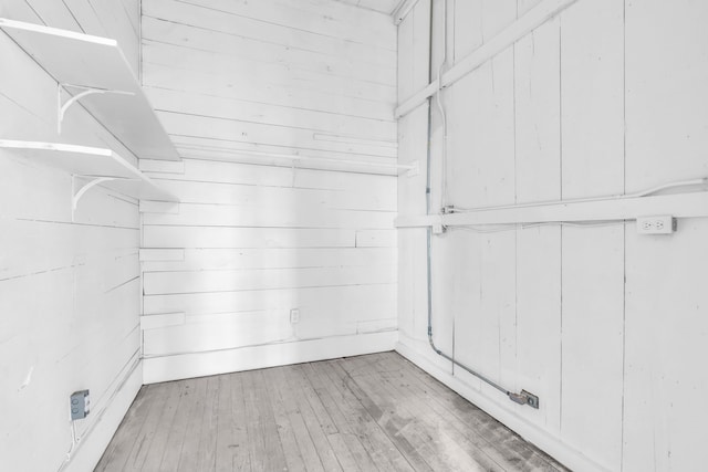 spacious closet with light hardwood / wood-style flooring