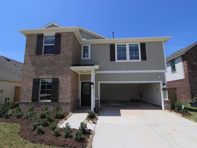 22435 Birchfield Grove Ln, New Caney, TX 77357 - traditional-style house with board and batten siding, concrete driveway, and a garage