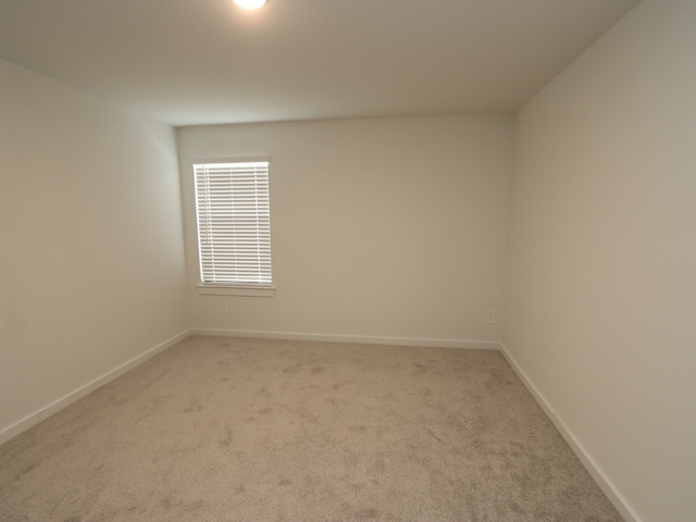 22435 Birchfield Grove Ln, New Caney, TX 77357 - unfurnished room featuring light colored carpet and baseboards