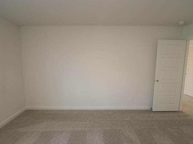 22435 Birchfield Grove Ln, New Caney, TX 77357 - spare room with carpet and a smoke detector