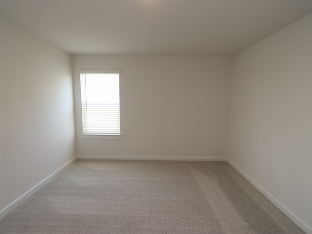 22435 Birchfield Grove Ln, New Caney, TX 77357 - empty room with light carpet