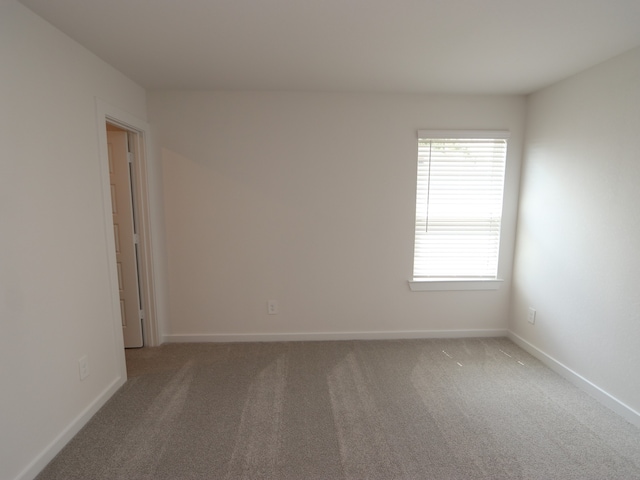 22435 Birchfield Grove Ln, New Caney, TX 77357 - carpeted spare room with baseboards