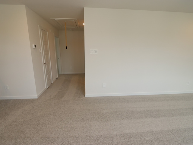22435 Birchfield Grove Ln, New Caney, TX 77357 - unfurnished room with attic access and light colored carpet