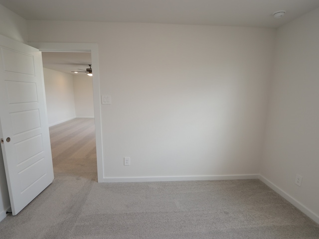 22435 Birchfield Grove Ln, New Caney, TX 77357 - empty room featuring light colored carpet, a smoke detector, and ceiling fan