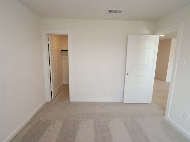 22435 Birchfield Grove Ln, New Caney, TX 77357 - unfurnished bedroom featuring carpet and a walk in closet