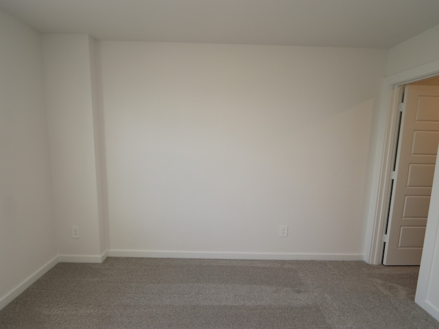 22435 Birchfield Grove Ln, New Caney, TX 77357 - carpeted spare room featuring baseboards