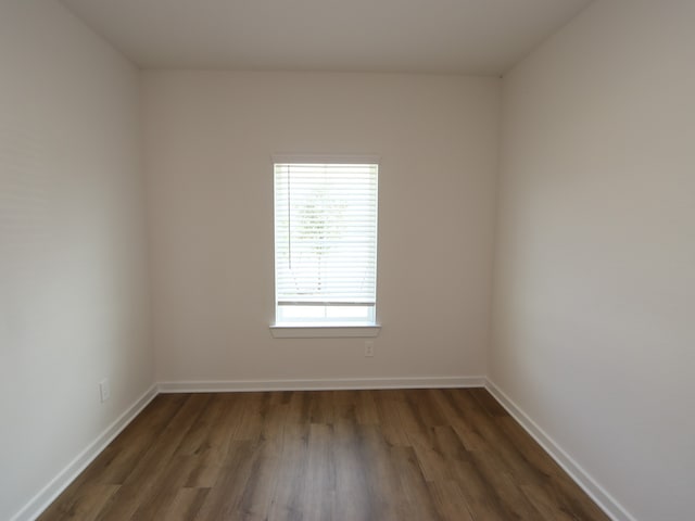 22435 Birchfield Grove Ln, New Caney, TX 77357 - unfurnished room featuring dark wood finished floors and baseboards