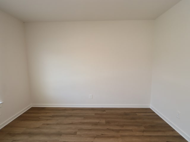 22435 Birchfield Grove Ln, New Caney, TX 77357 - unfurnished room with dark wood finished floors