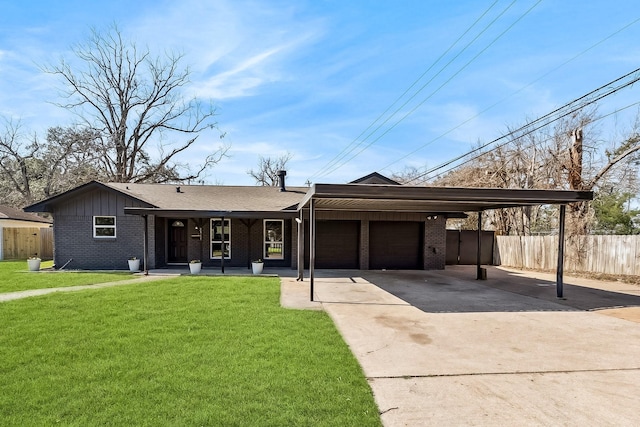 ranch-style home featuring a front yard, a garage, and a carport