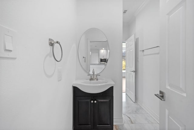 bathroom with marble finish floor, visible vents, ornamental molding, vanity, and baseboards