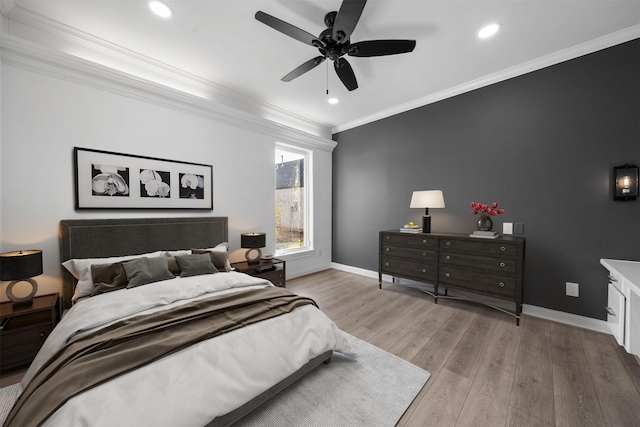 bedroom with baseboards, a ceiling fan, light wood-style flooring, ornamental molding, and recessed lighting