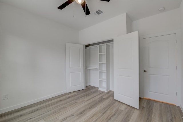 unfurnished bedroom featuring light wood-type flooring, a closet, and ceiling fan