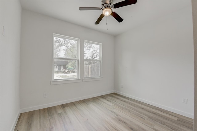 spare room featuring ceiling fan and light hardwood / wood-style flooring