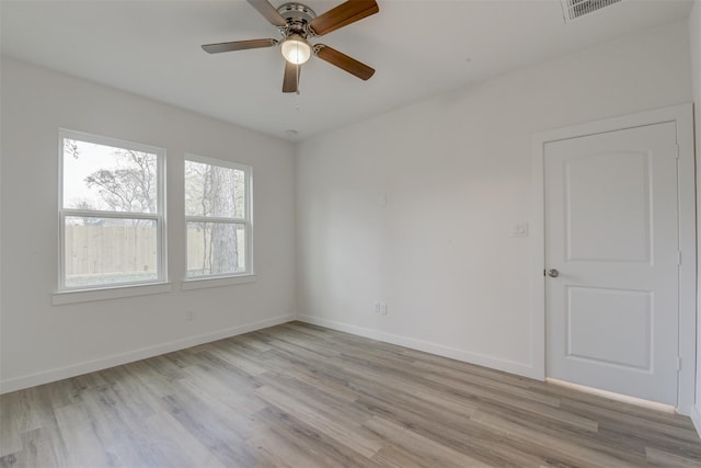 spare room featuring ceiling fan and light hardwood / wood-style flooring