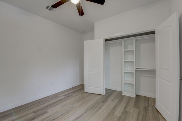 unfurnished bedroom featuring light wood-type flooring, a closet, and ceiling fan