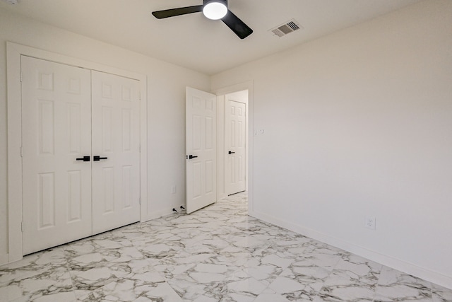 unfurnished bedroom with a closet and ceiling fan