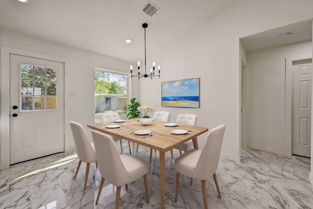 dining space with a notable chandelier