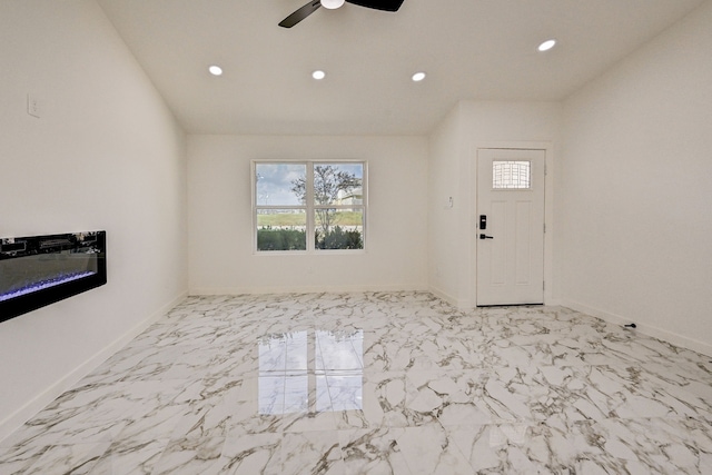 entryway with vaulted ceiling and ceiling fan