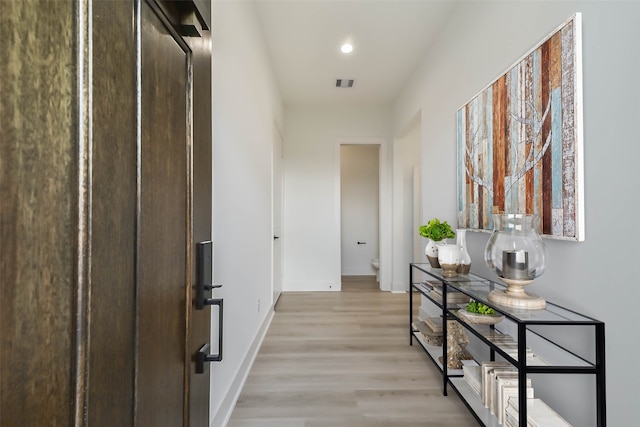 4430 Edmund St, Houston, TX 77020 - corridor with light wood-style flooring, baseboards, and recessed lighting