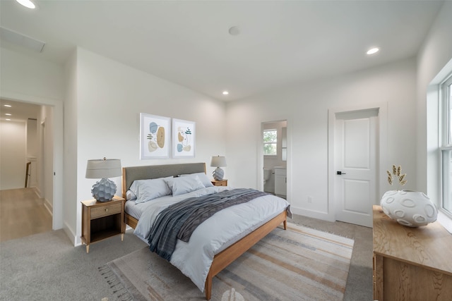 4430 Edmund St, Houston, TX 77020 - bedroom featuring recessed lighting, light carpet, ensuite bathroom, and baseboards