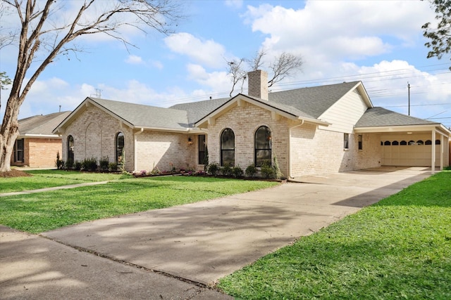 view of front of house with a garage and a front lawn