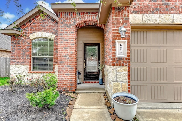 doorway to property featuring a garage