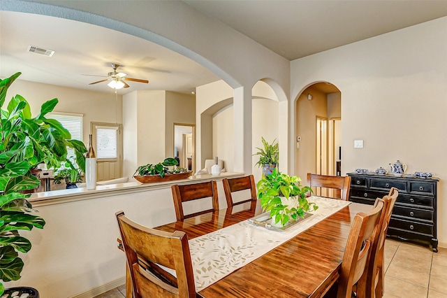 dining room with ceiling fan and light tile patterned floors