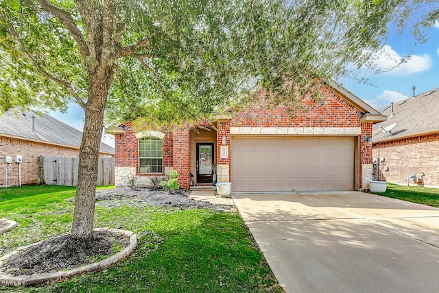 view of front of house with a front yard and a garage