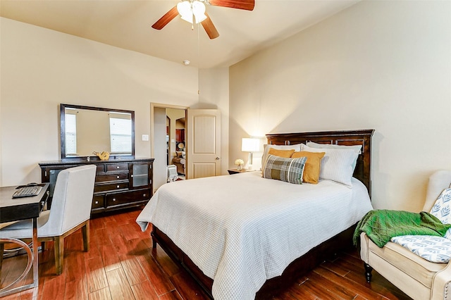 bedroom with ceiling fan and dark hardwood / wood-style floors