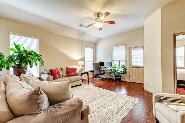 living room with lofted ceiling, ceiling fan, and dark hardwood / wood-style floors