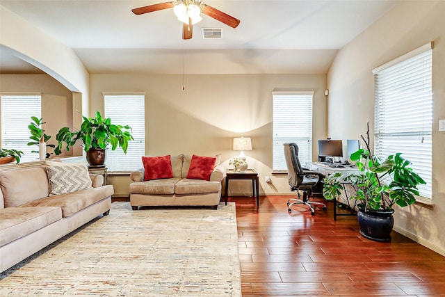 living room featuring hardwood / wood-style floors, lofted ceiling, and ceiling fan