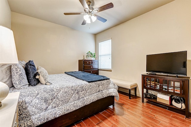 bedroom with light hardwood / wood-style flooring and ceiling fan